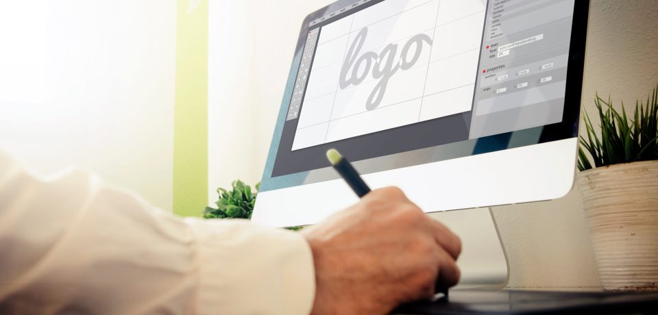 designer designing a logo. All screen graphics are made up.