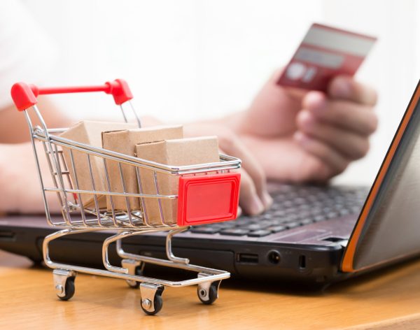 Hand men using laptop and buy goods from a seller over the internet. online shopping concept